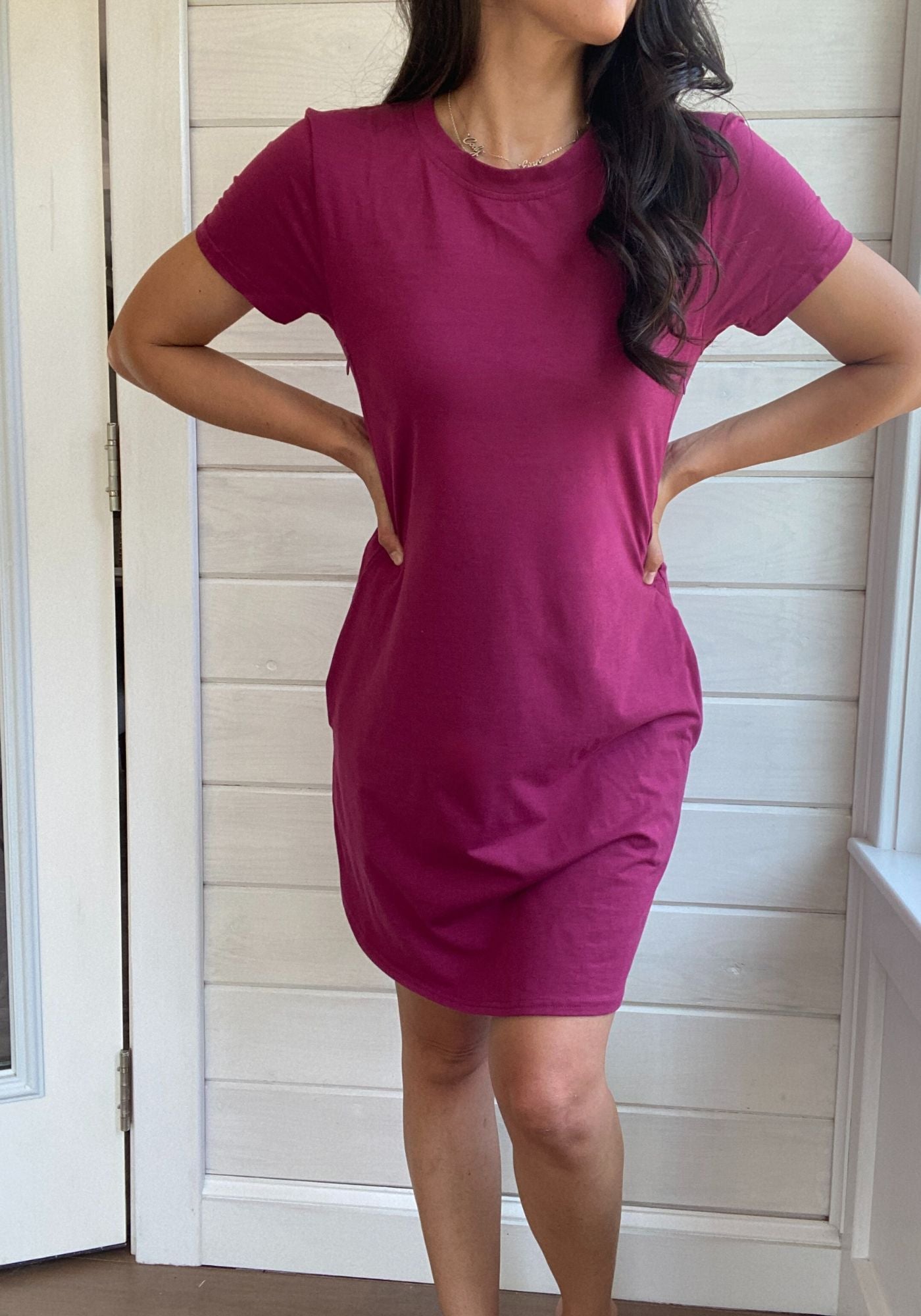 Breastfeeding T-Shirt Dress in dark pink. Two Zippers on right and left side to provide accessibility to nursing mothers. Pockets, rounded hem with two small slits on either side. T-Shirt Style dress perfect to nurse your child in.