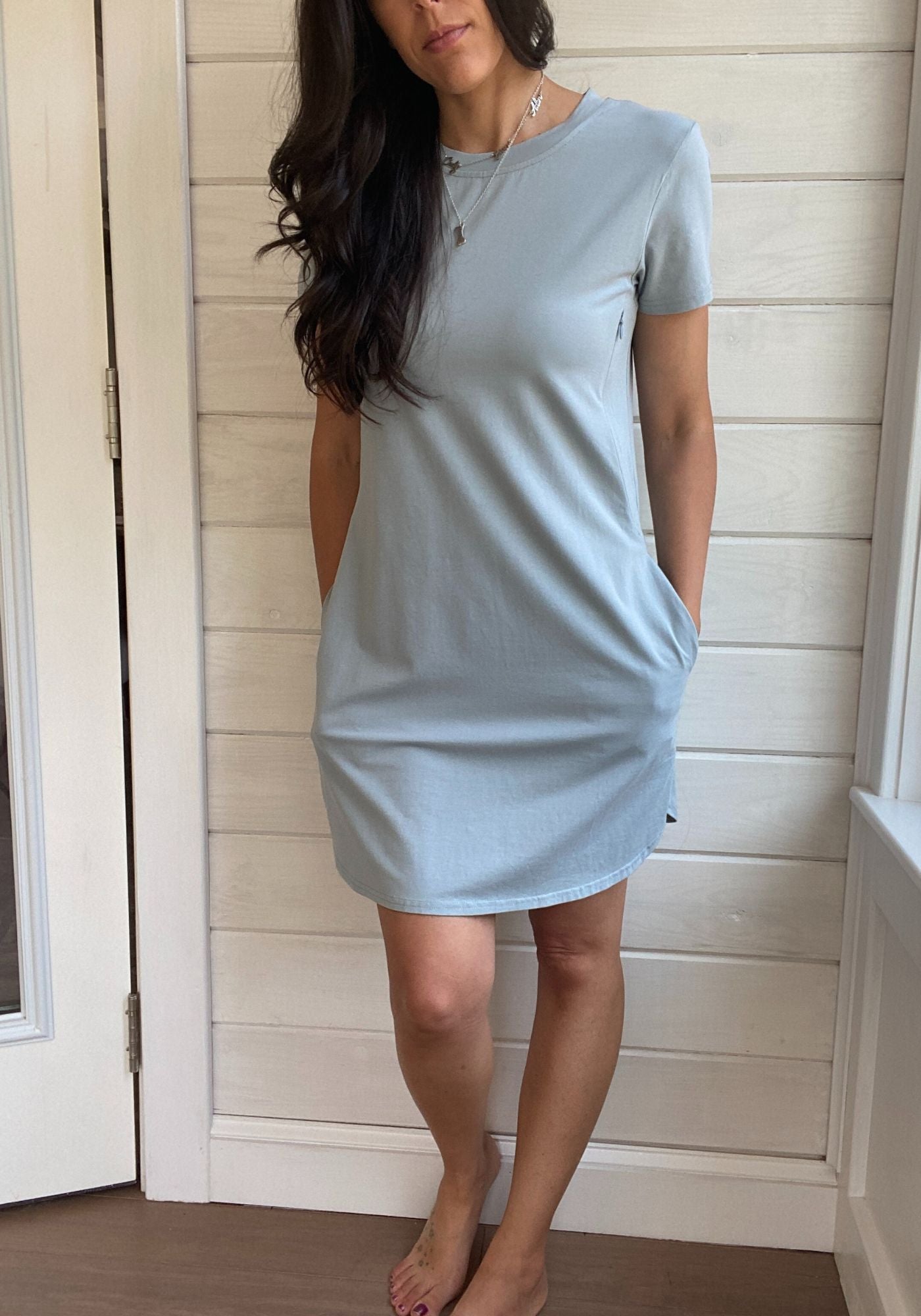 Breastfeeding T-Shirt Dress in Light blue. Two Zippers on right and left side to provide accessibility to nursing mothers. Pockets, rounded hem with two small slits on either side. T-Shirt Style dress perfect to nurse your child in.