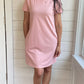 Breastfeeding T-Shirt Dress in Light pink. Two Zippers on right and left side to provide accessibility to nursing mothers. Pockets, rounded hem with two small slits on either side. T-Shirt Style dress perfect to nurse your child in.