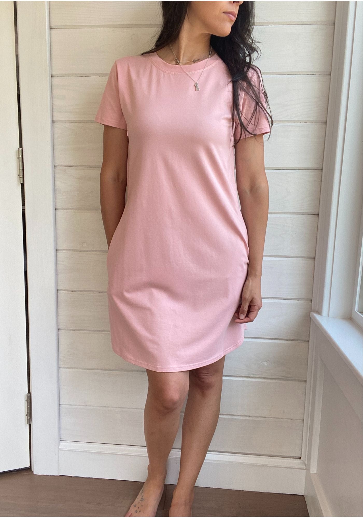 Breastfeeding T-Shirt Dress in Light pink. Two Zippers on right and left side to provide accessibility to nursing mothers. Pockets, rounded hem with two small slits on either side. T-Shirt Style dress perfect to nurse your child in.