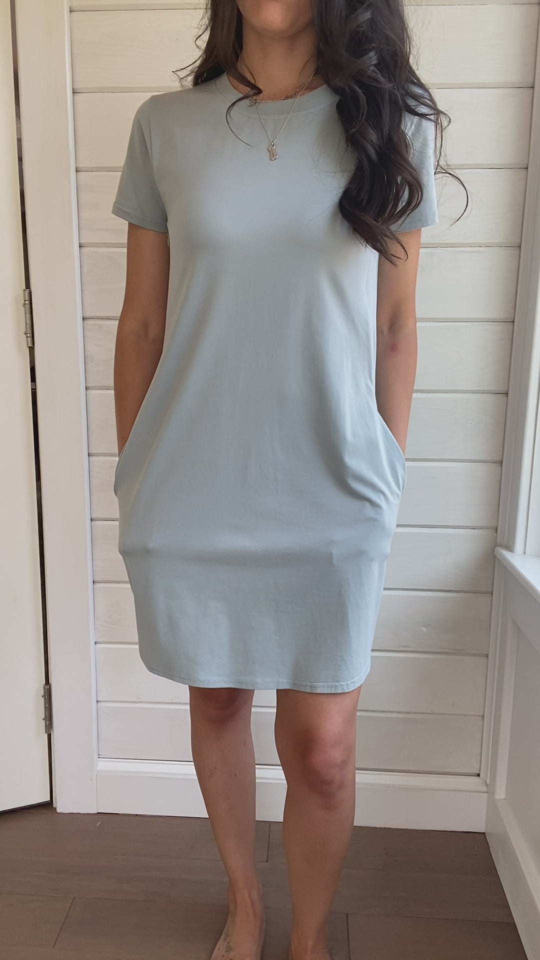 Breastfeeding T-Shirt Dress in light blue Video of model showing how to unzip and zip back up, pocket usage.. Two Zippers on right and left side to provide accessibility to nursing mothers. Pockets, rounded hem with two small slits on either side. T-Shirt Style dress perfect to nurse your child in.