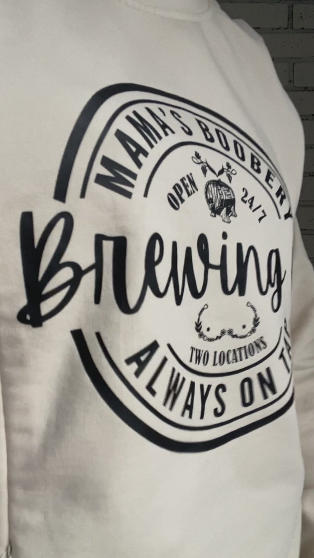 Women showing how to use the mama boobery brewing co always on tap designed crewneck sweatshirt that is breastfeeding and pumping friendly with two zippers on either side that open with the zipper on the bottom.