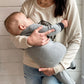 Women wearing a beige crewneck sweatshirt with a design logo Mama's Boobery Brewing Co Open 24/7 Always on Tap Two Locations in black with two zippers on either side for easy access to breastfeed or pump. Right side of zipper is open and she is holding a baby nursing him to show how the sweatshirt is breastfeeding friendly.