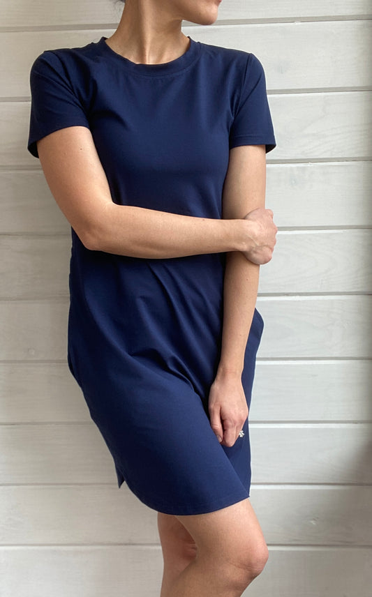 Breastfeeding T-Shirt Dress in Navy. Two Zippers on right and left side to provide accessibility to nursing mothers. Pockets, rounded hem with two small slits on either side. T-Shirt Style dress perfect to nurse your child in.
